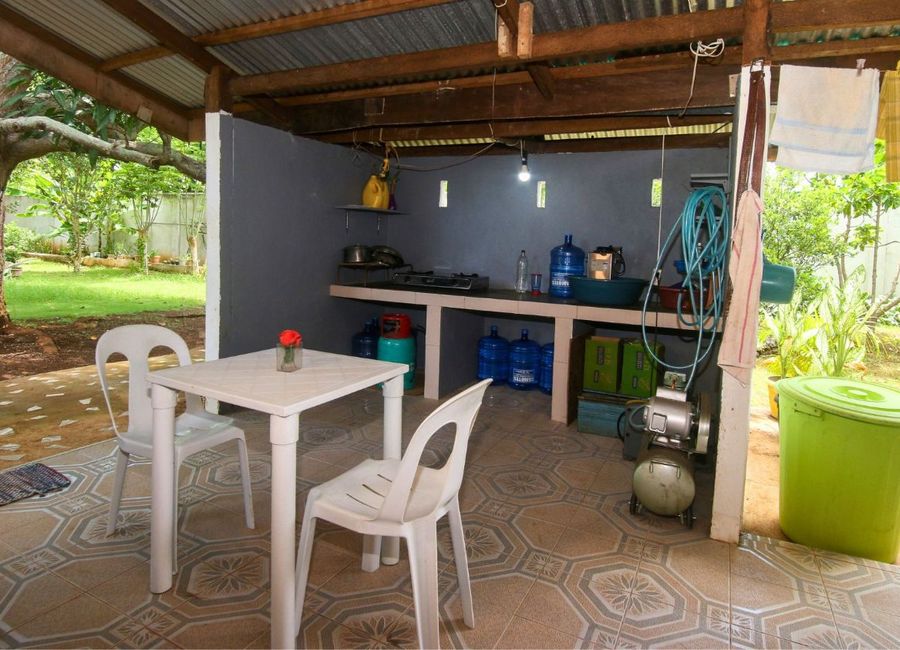 Fenced Property With Native House